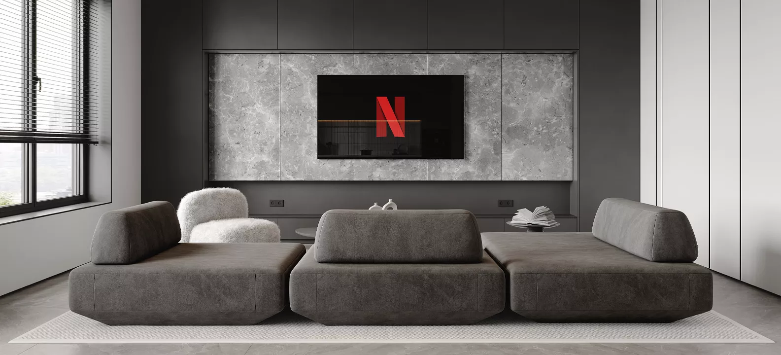 Visualisierung eines Wohnzimmers mit großer Couch und einem Fernseher, auf dem das Netflix-Symbol zu sehen ist